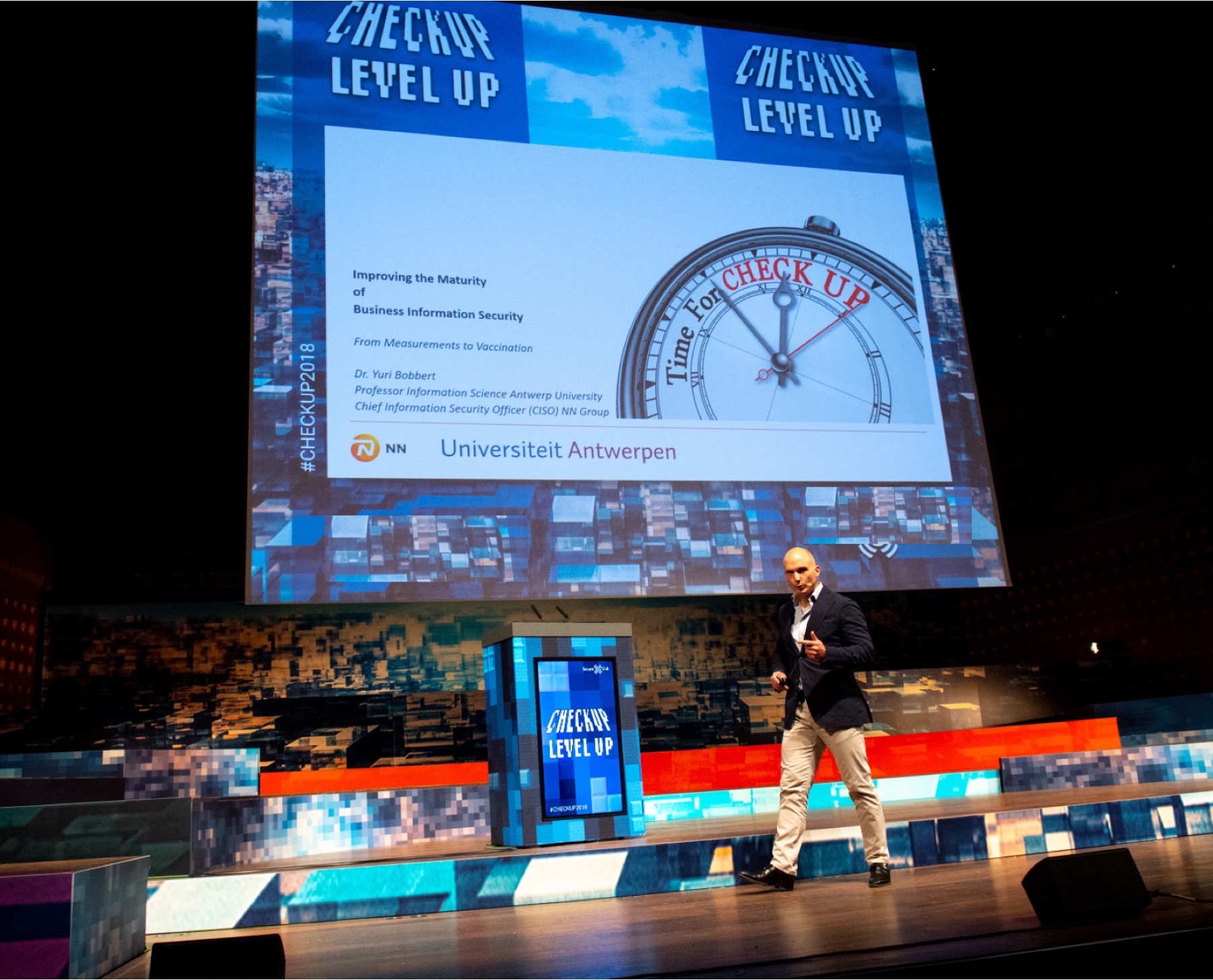 Yuri Bobbert delivering a conference keynote on improving the maturity of business information security